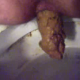A female shitting ass on a toilet from a close-up perspective. This is a nice big poop. Full audio included.